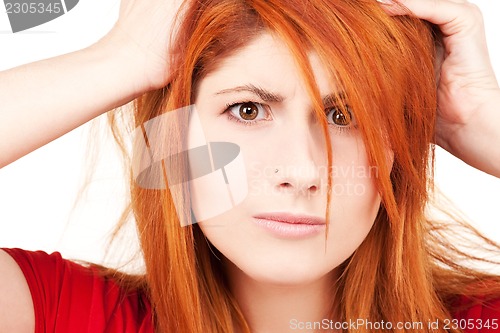 Image of unhappy redhead woman