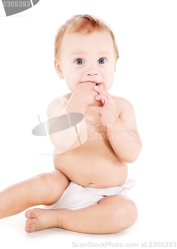 Image of sitting baby boy in diaper