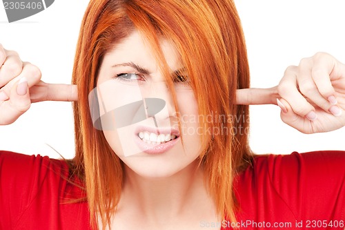 Image of unhappy redhead woman