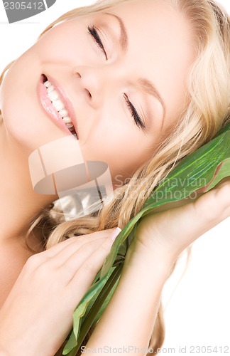 Image of woman with green leaf