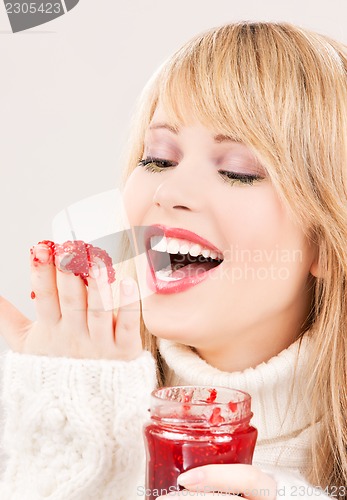Image of happy teenage girl with raspberry jam
