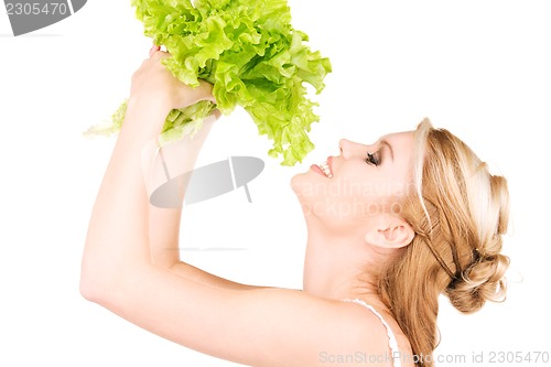 Image of happy woman with lettuce