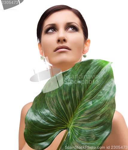 Image of woman with green leaf