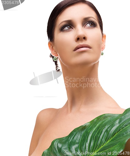 Image of woman with green leaf