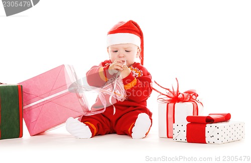 Image of santa helper baby with christmas gifts