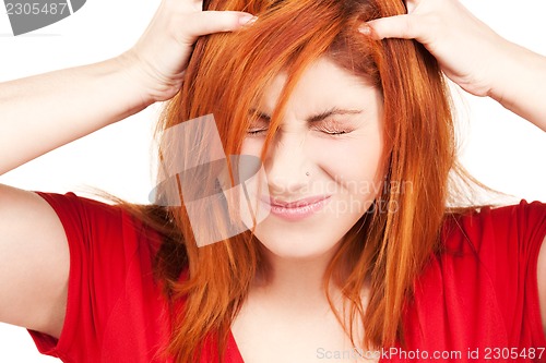 Image of unhappy redhead woman