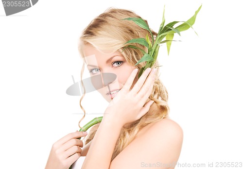 Image of woman with bamboo