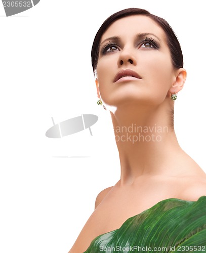 Image of woman with green leaf