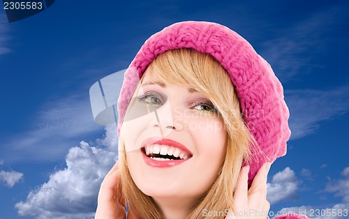 Image of teenage girl in hat over winter sky