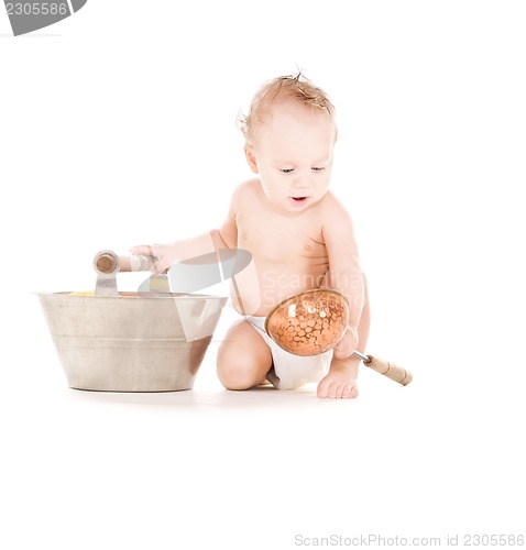 Image of baby boy with wash-tub and scoop