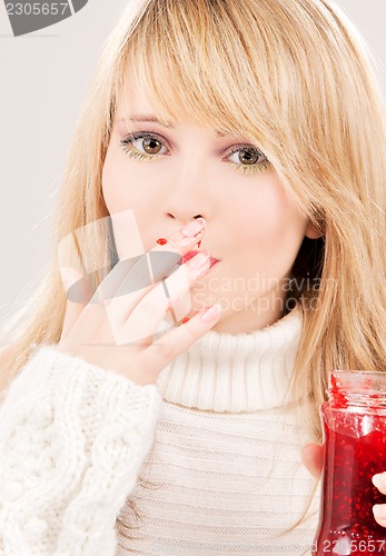 Image of happy teenage girl with raspberry jam