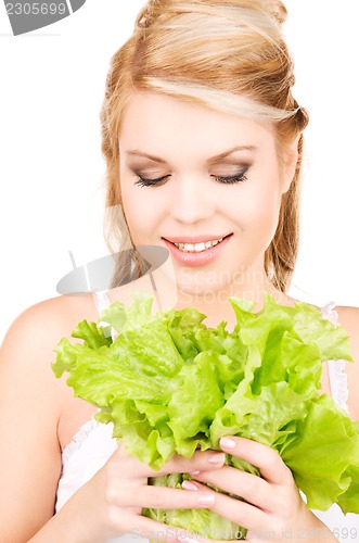 Image of happy woman with lettuce