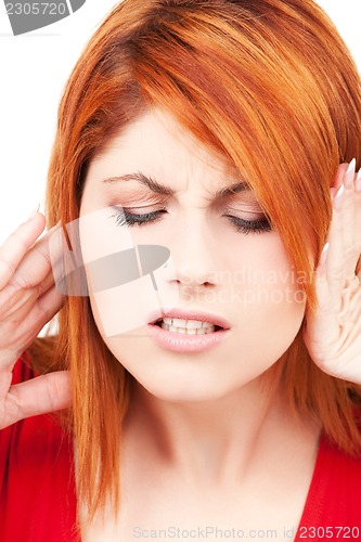 Image of unhappy redhead woman