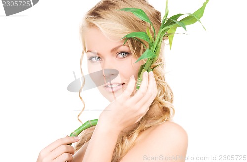 Image of woman with bamboo