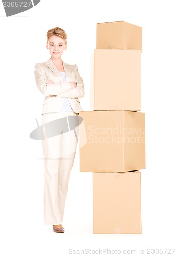 Image of businesswoman with boxes