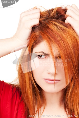 Image of unhappy redhead woman