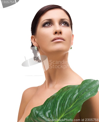 Image of woman with green leaf