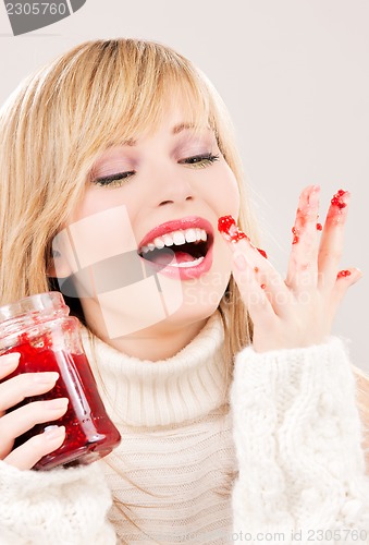 Image of happy teenage girl with raspberry jam
