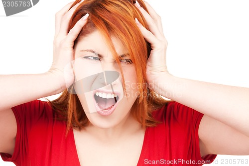 Image of unhappy redhead woman