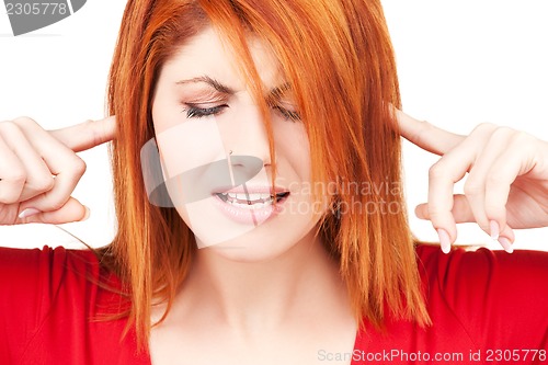 Image of unhappy redhead woman