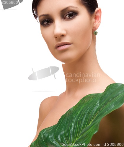 Image of woman with green leaf