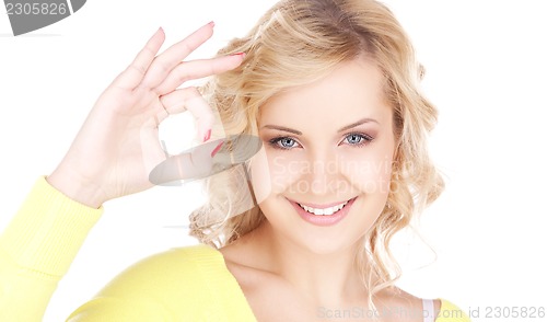 Image of lovely blonde showing ok sign