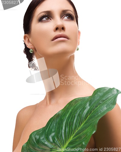 Image of woman with green leaf