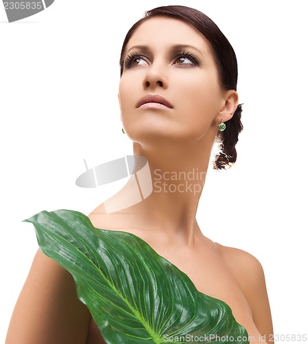 Image of woman with green leaf