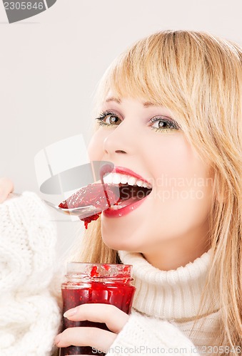 Image of happy teenage girl with raspberry jam