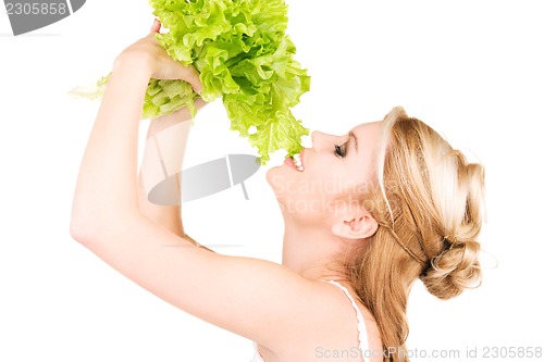 Image of happy woman with lettuce