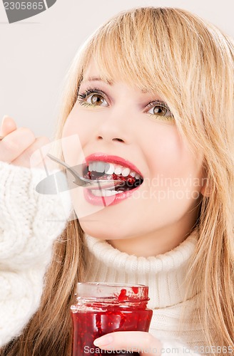 Image of happy teenage girl with raspberry jam