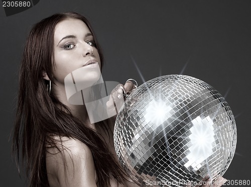 Image of beautiful naked woman with disco ball