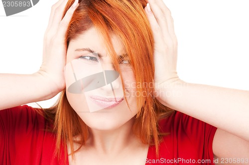 Image of unhappy redhead woman