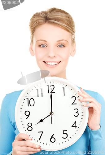 Image of woman holding big clock