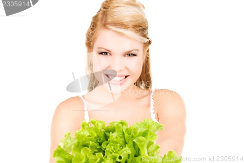 Image of happy woman with lettuce