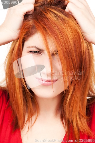 Image of unhappy redhead woman