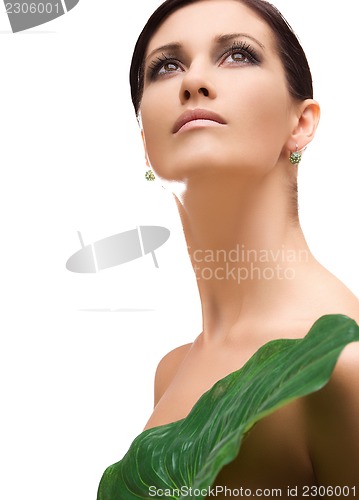 Image of woman with green leaf