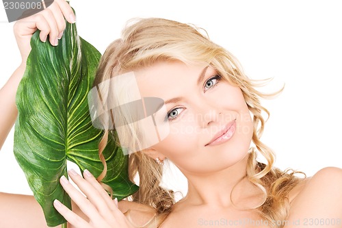 Image of woman with green leaf