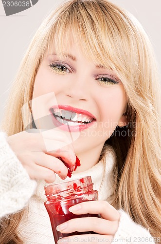 Image of happy teenage girl with raspberry jam
