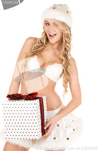 Image of cheerful santa helper girl with gift box