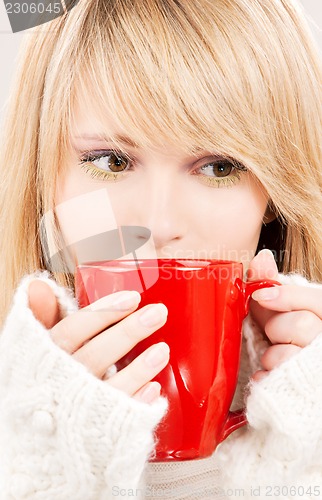 Image of teenage girl with red mug