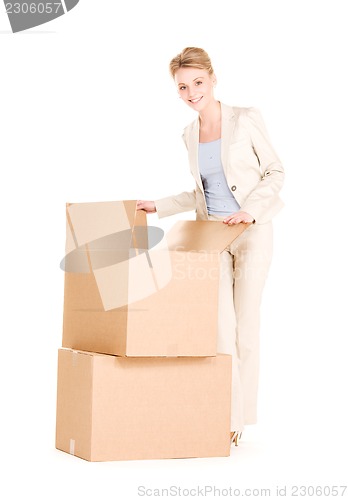 Image of businesswoman with boxes