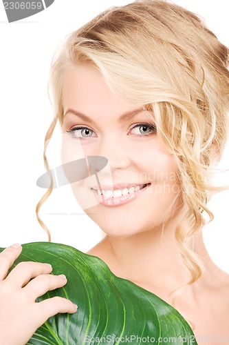 Image of woman with green leaf