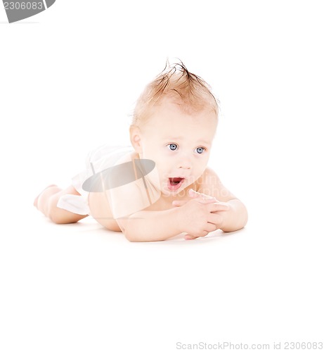 Image of yawning baby boy in diaper