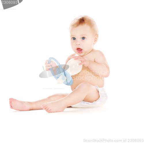 Image of baby boy with big pacifier