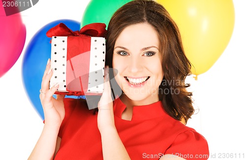 Image of woman with gift box and balloons