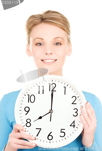 Image of woman holding big clock