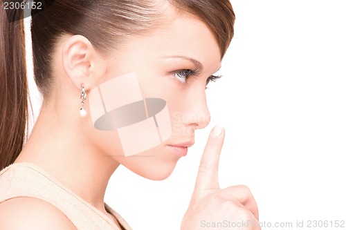 Image of finger on lips