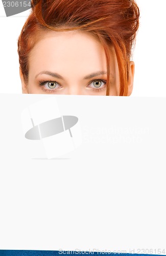 Image of redhead woman with blank board