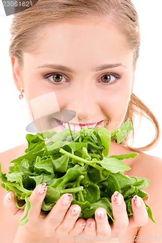 Image of happy woman with spinach